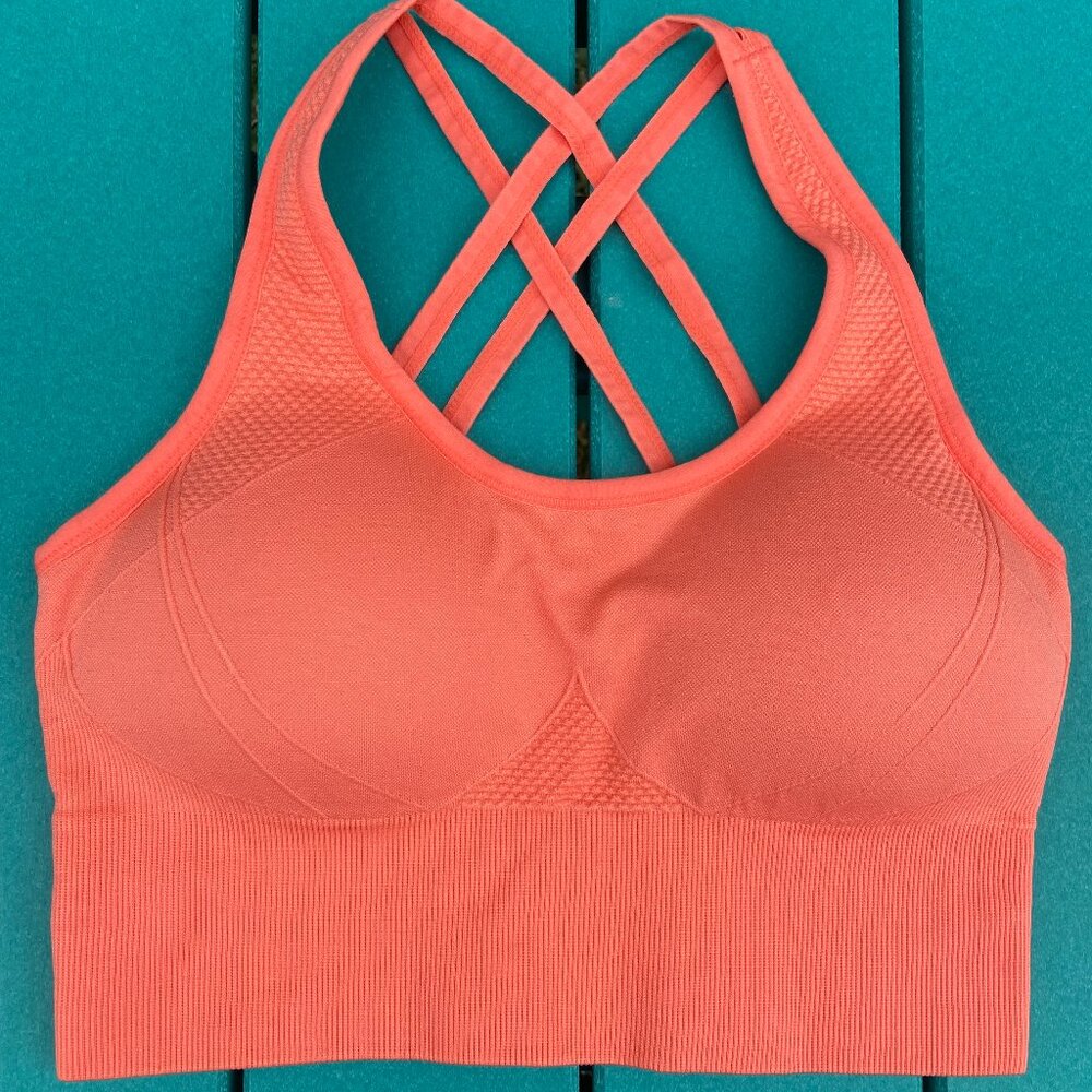 NWOT Velocity padded sports bra. Firm support, size Small. Coral/orange color.